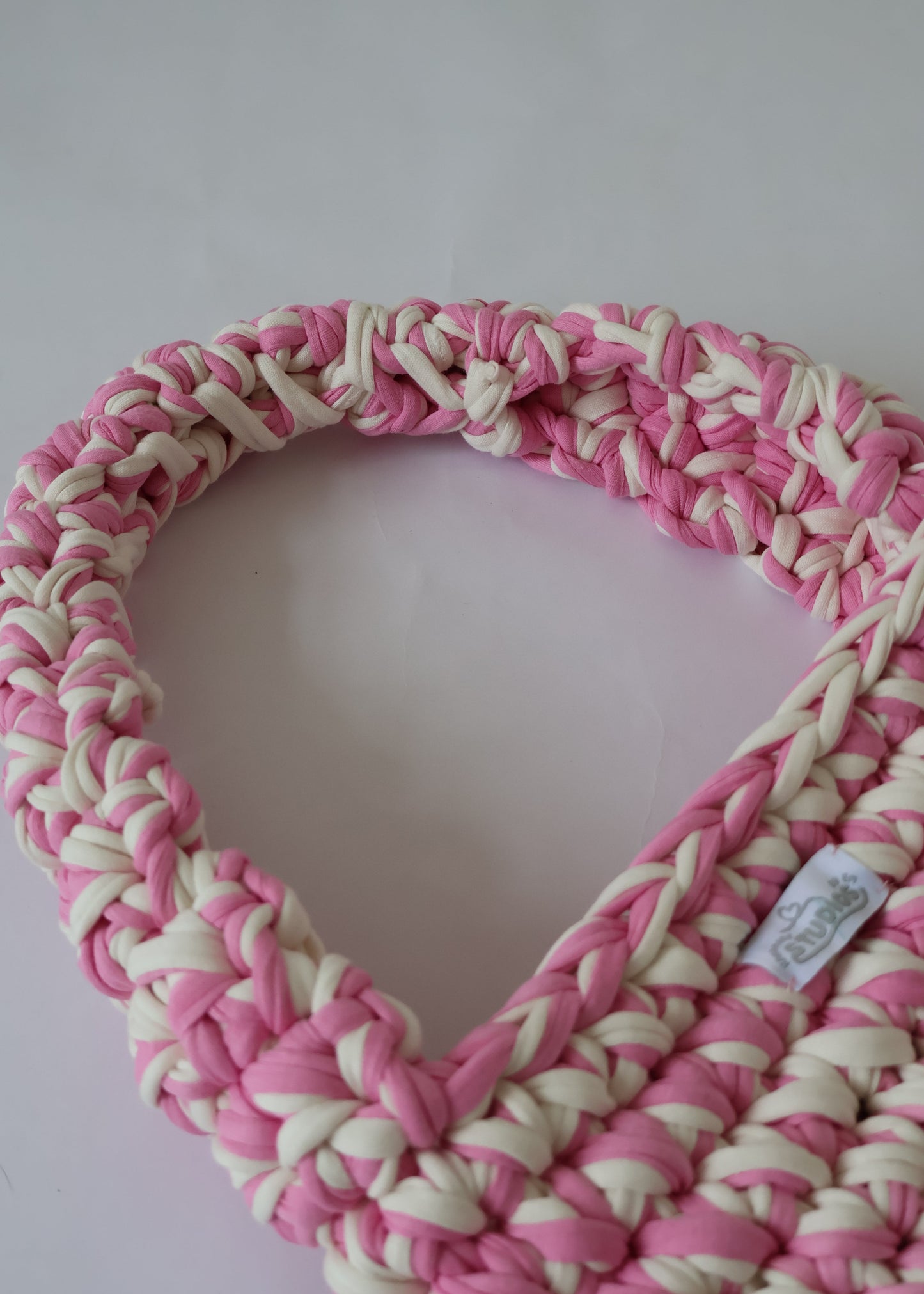 Handmade crochet shoulder bag in pink and white yarn