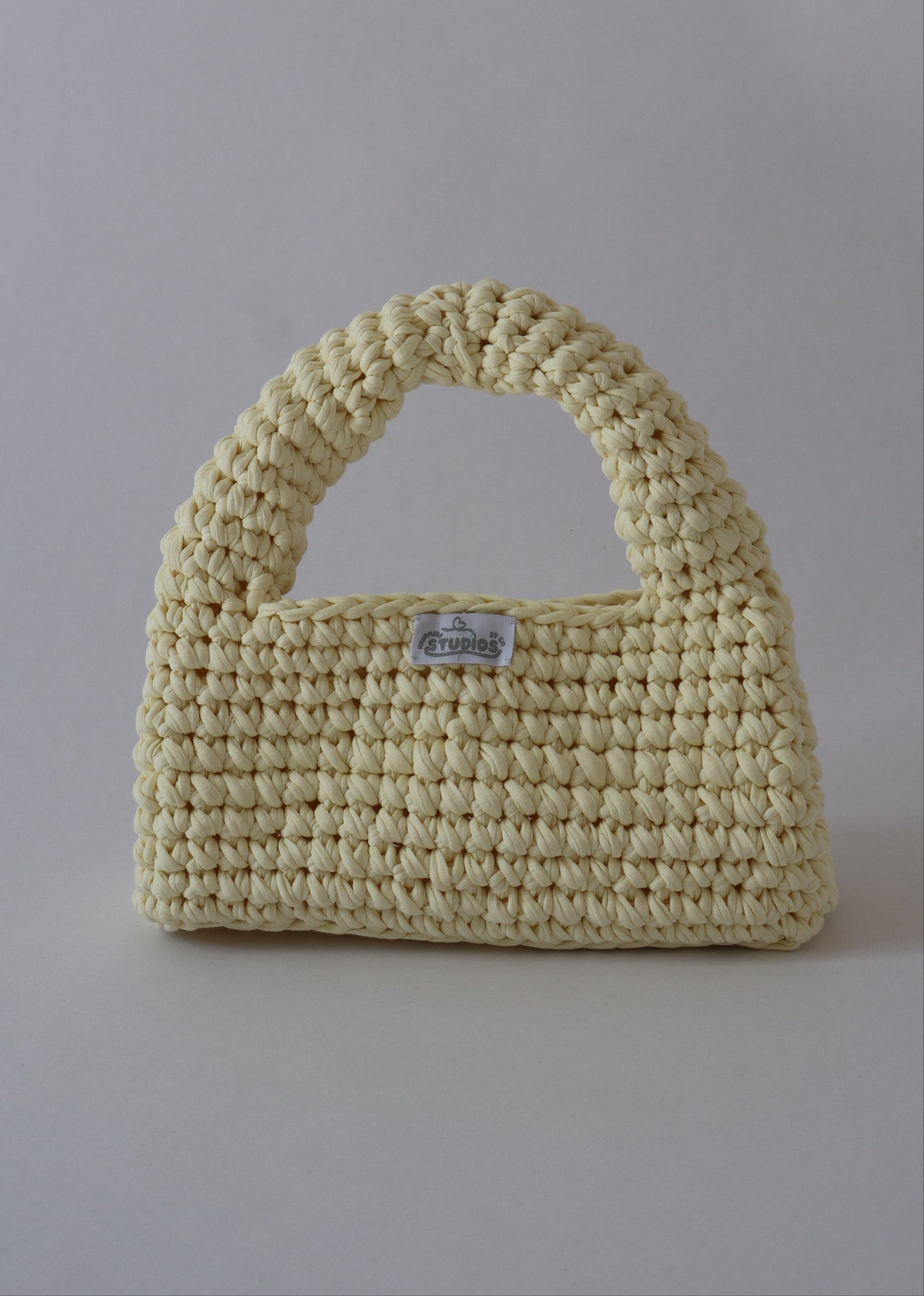 Add a pop of sunshine to your outfit with our hand-crocheted Butter Yellow Crush — lightweight, sustainable, and effortlessly cute!
