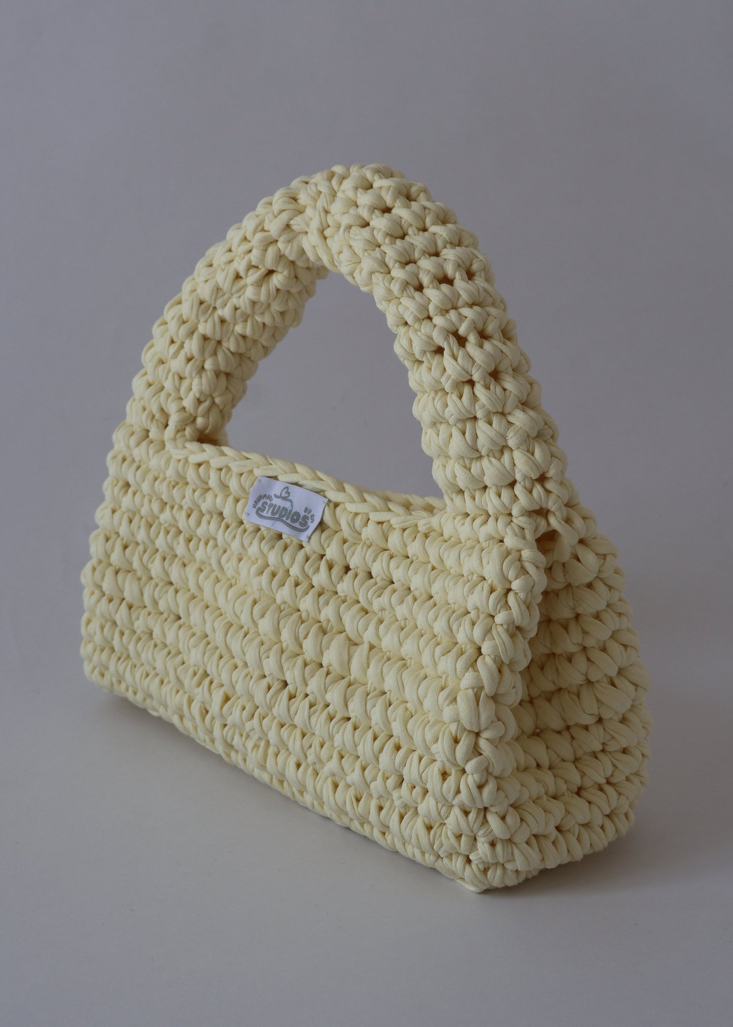 Add a pop of sunshine to your outfit with our hand-crocheted Butter Yellow Crush — lightweight, sustainable, and effortlessly cute!