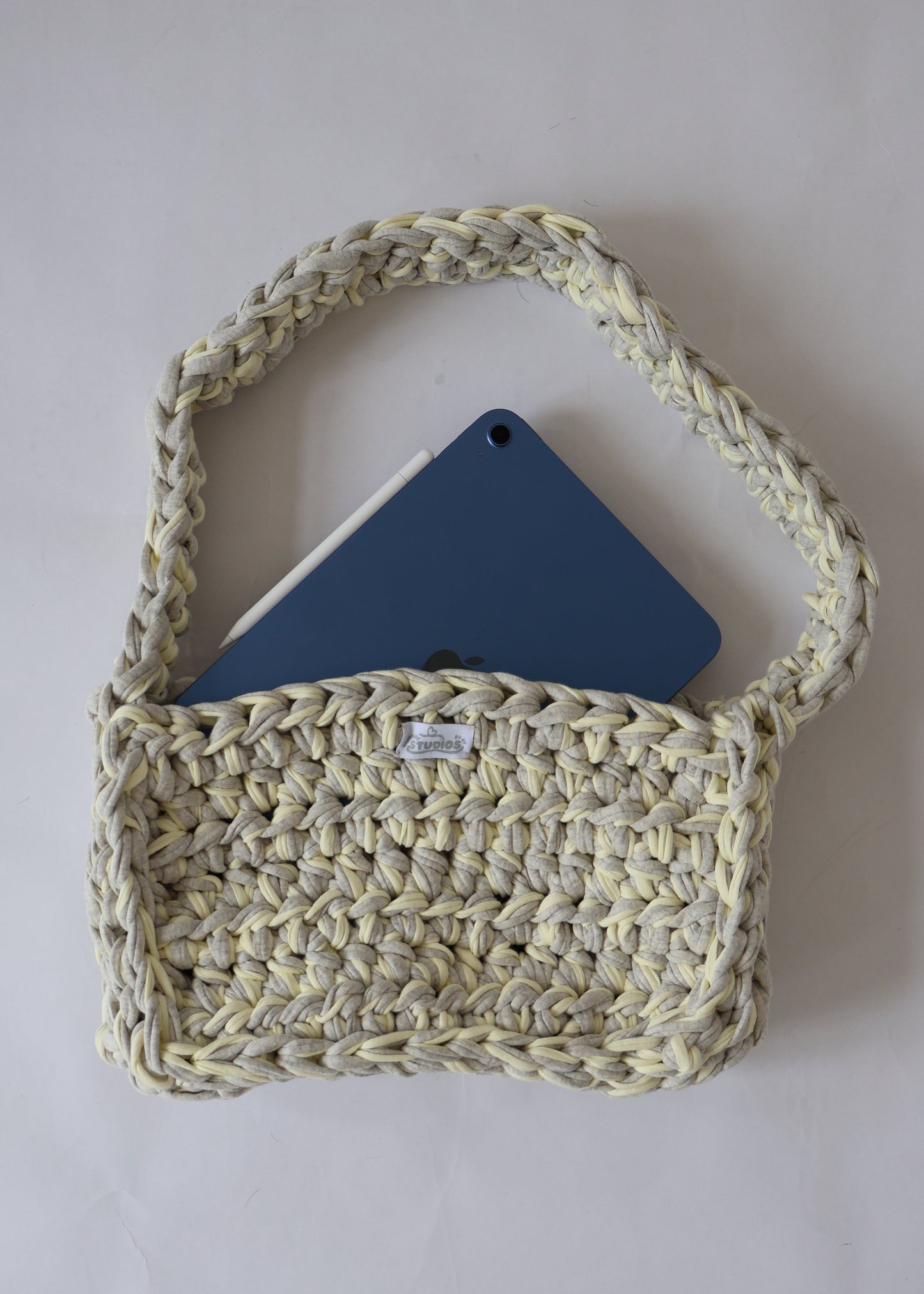 Soft, slouchy, and sustainably made—this lemon and grey crochet shoulder bag is perfect for relaxed, everyday outfits.